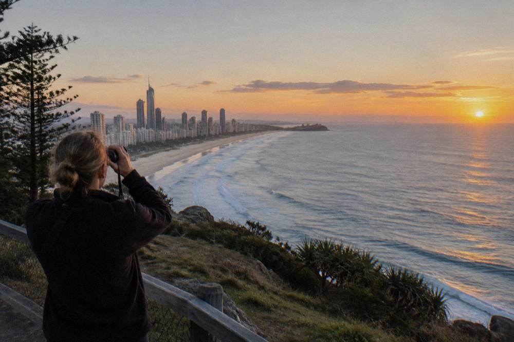 An elevated headland lookout above a long sandy beach with open ocean beyond